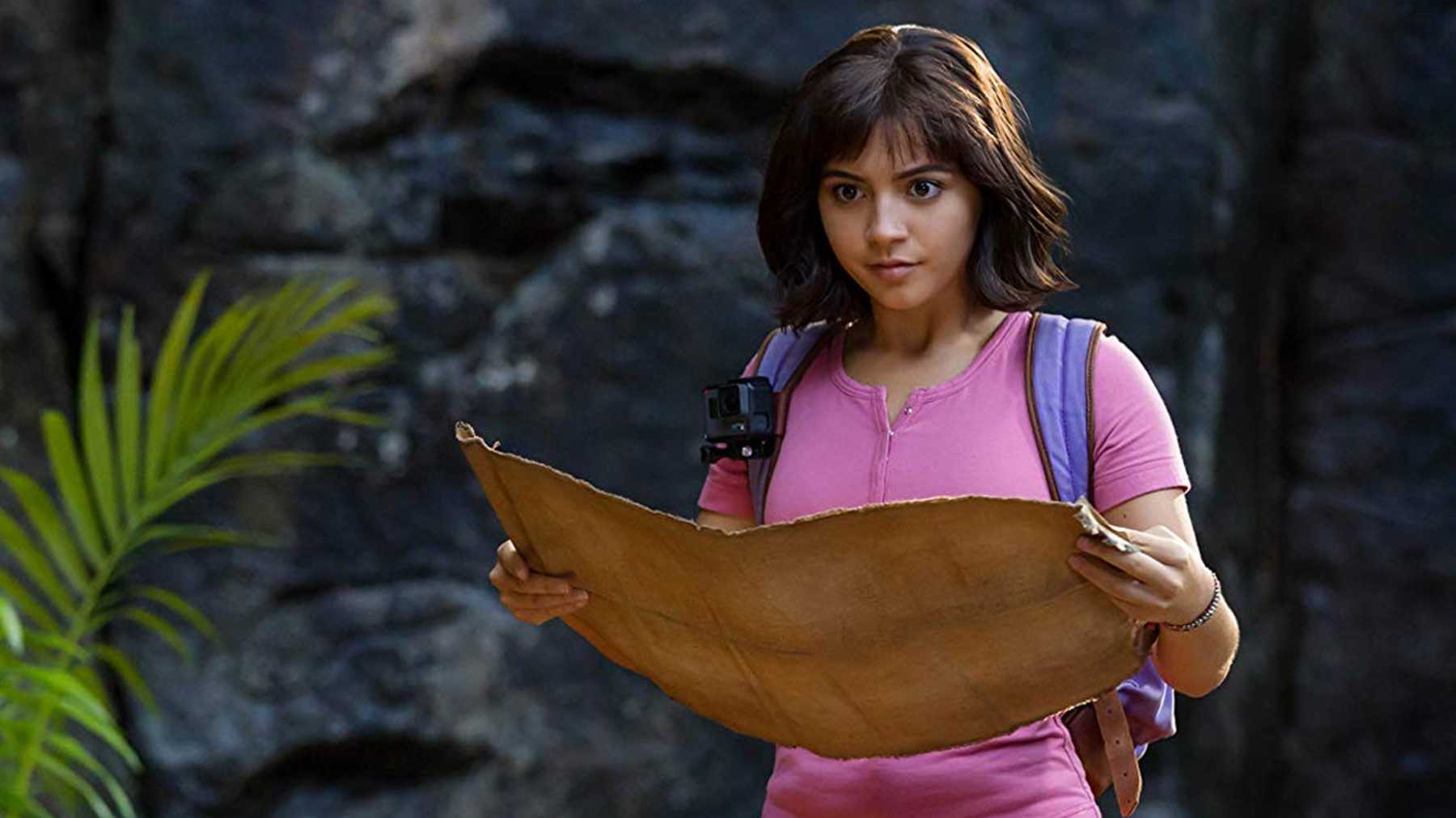 Dora (Isabela Merced) holding a map